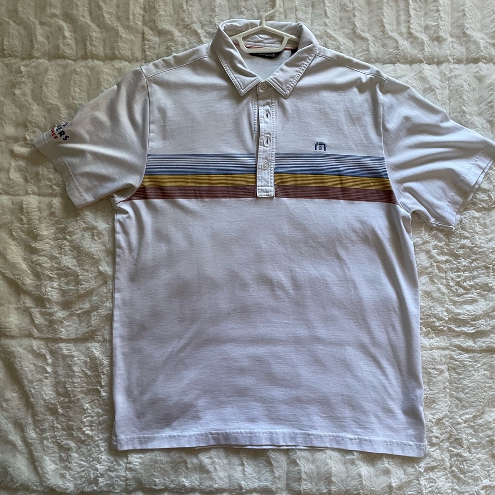 Men’s White Travis Mathew Golf Polo with Farmers Insurance Logo on Sleeve